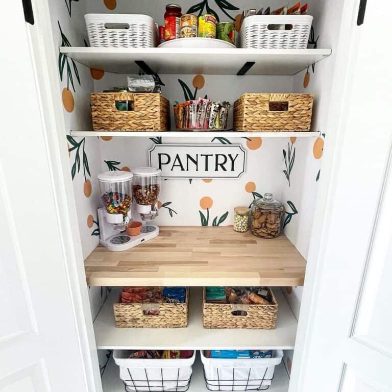 White Double Pantry Doors Show Off Flowered Wallpaper