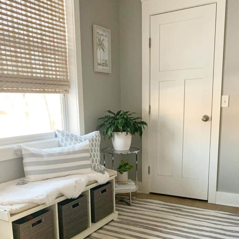 White Entryway Bench With Storage Under a Window