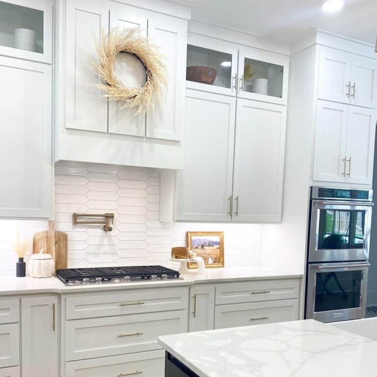 White Kitchen Cabinet Crown Molding Above White Counters