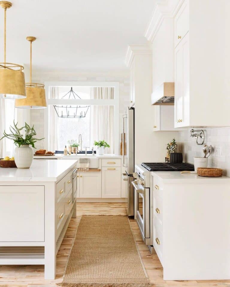 White Kitchen Cabinet Crown Molding and Gold Pendant Lamps