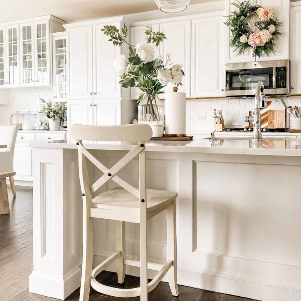 White Kitchen Cabinets with Pink Flower Wreath