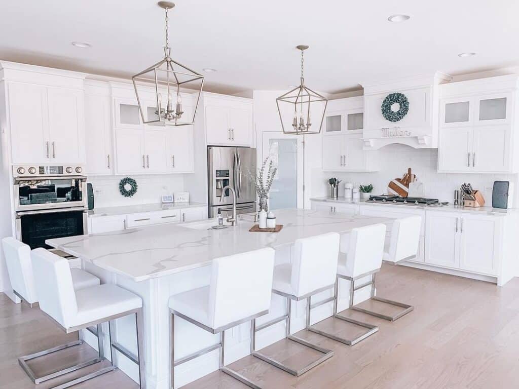 White Kitchen with Light Wood Flooring