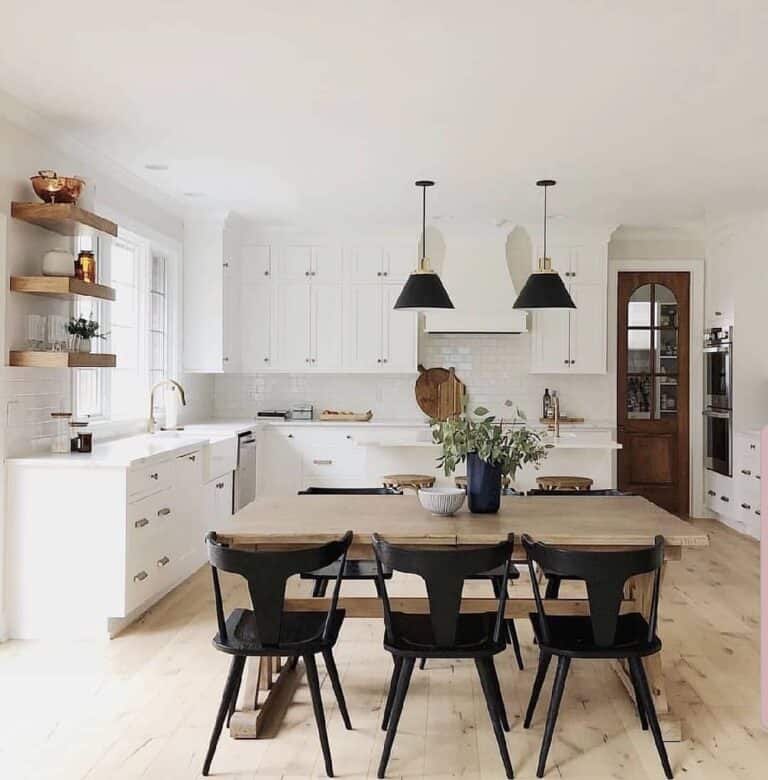 White Kitchen with Light Wood Floors and Black Accents