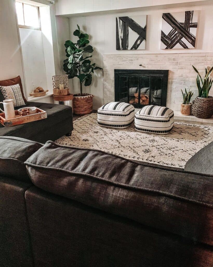 White Living Room Poufs in Front of a Fireplace