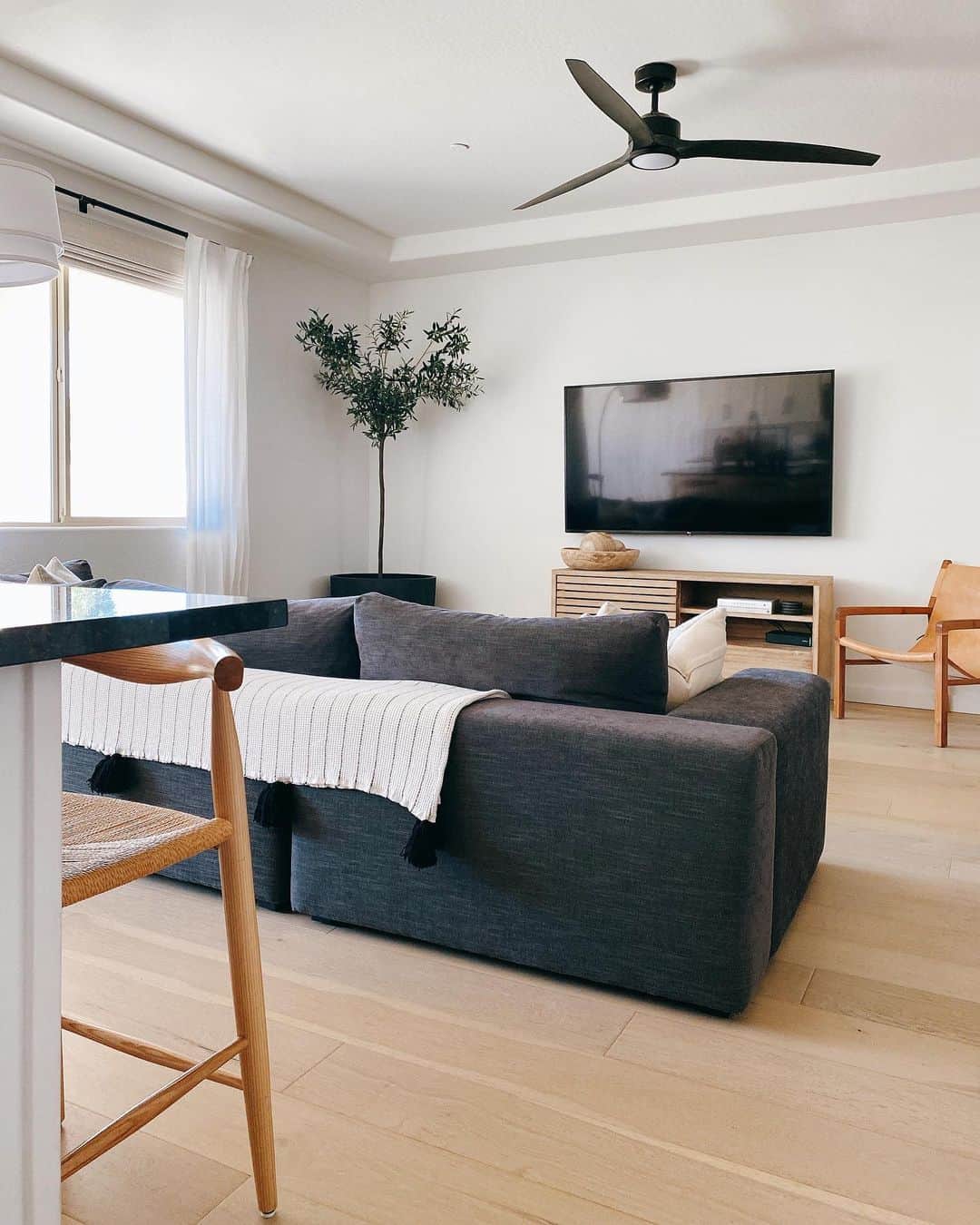 White Living Room with Black Ceiling Fan Soul & Lane