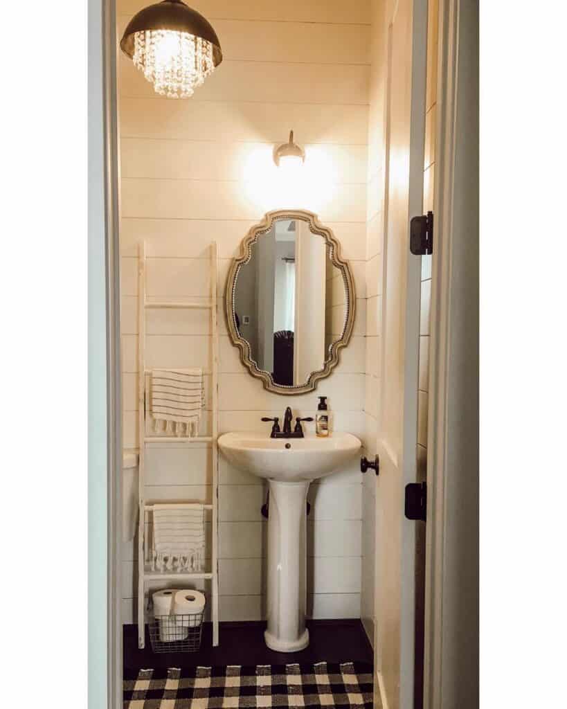 White Powder Room with Scalloped Mirror and Pedestal Sink