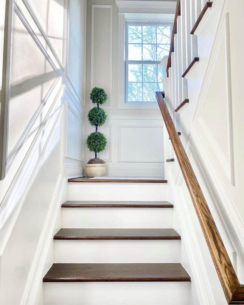 White Staircase Wainscoting with Decorative Molding