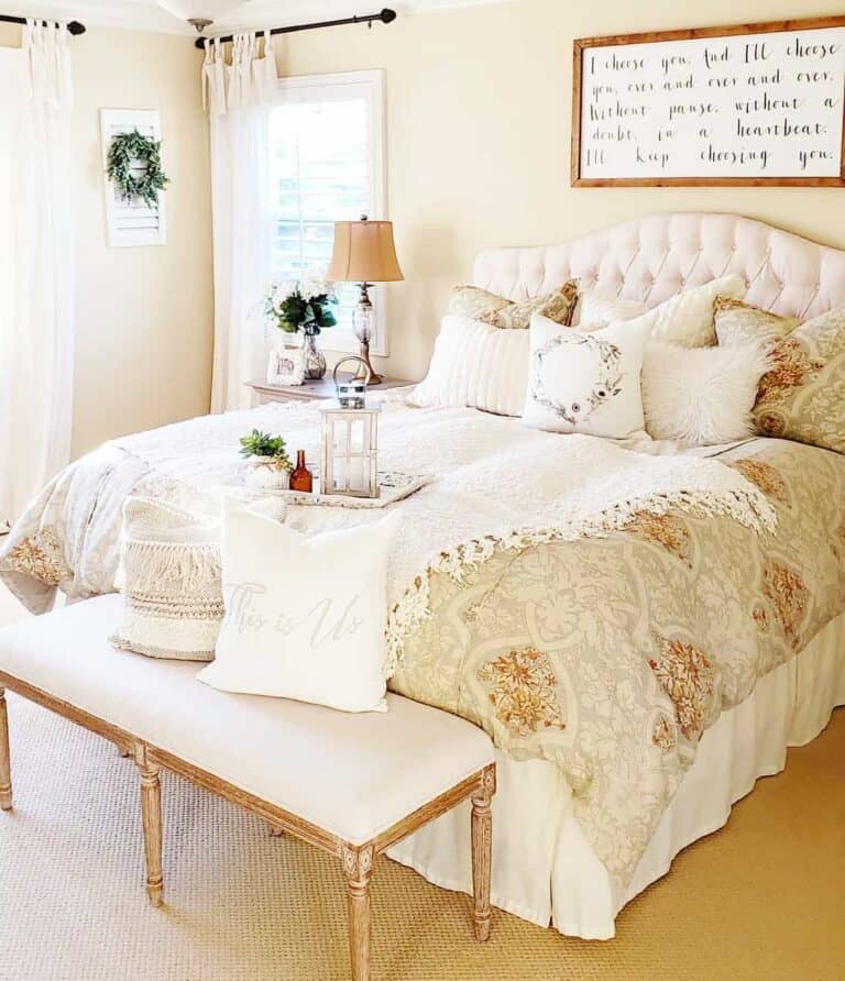 White Tufted Headboard Against Off-White Walls