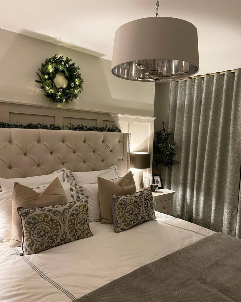 White Tufted Headboard Against White Wainscoting