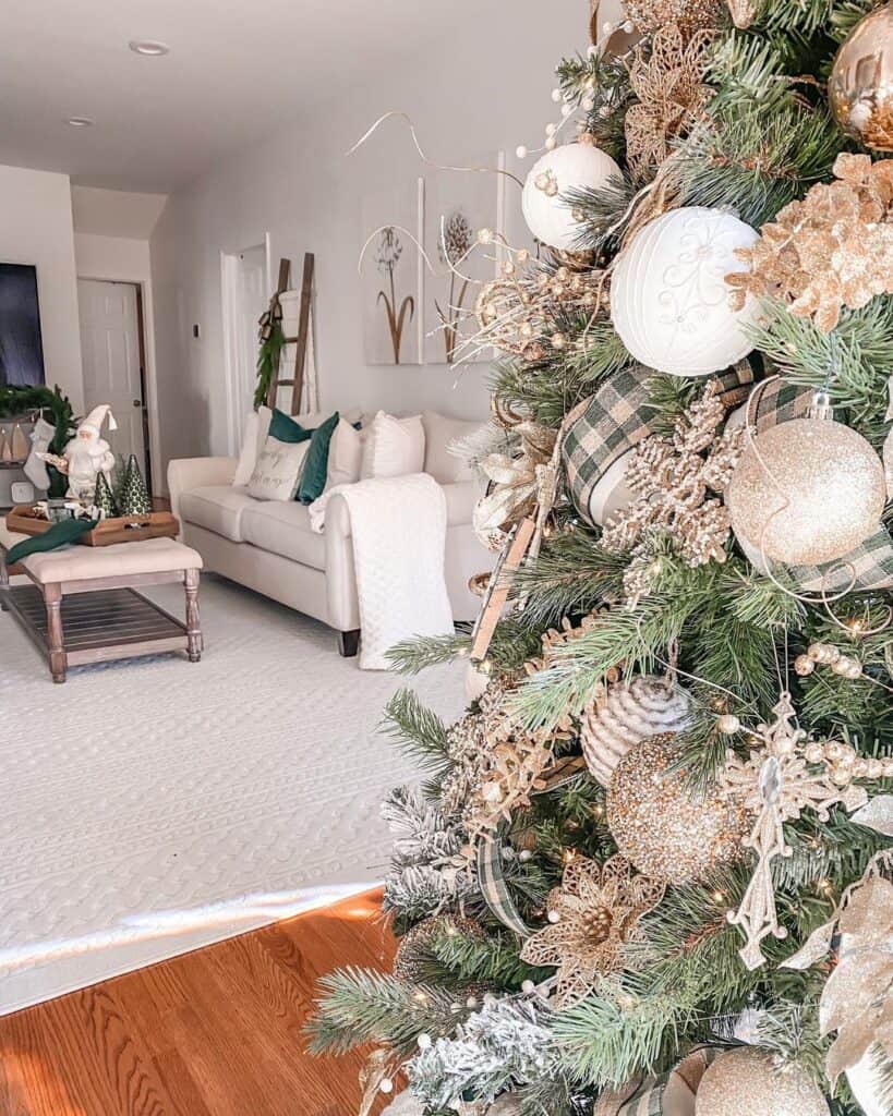White and Gold Christmas Tree Decorations in a White Living Room