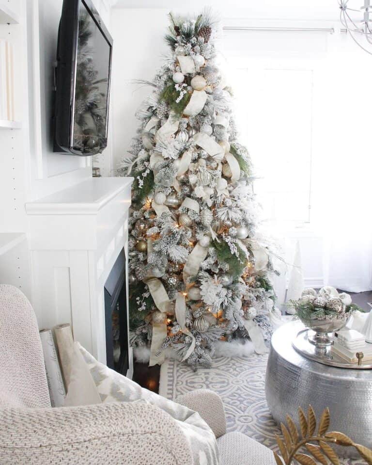 White and Gold Christmas Tree Decorations near a Round Silver Coffee Table