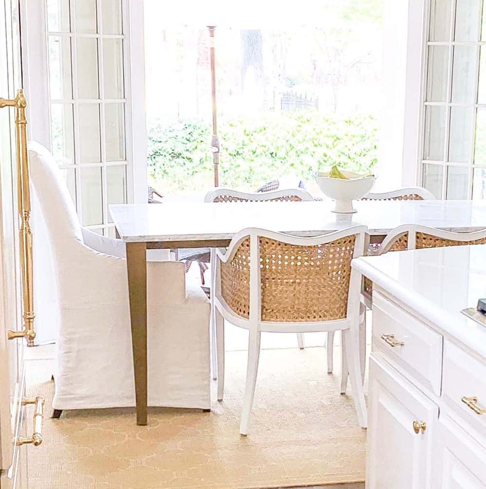 White and Wood Dining Chairs and Open French Doors