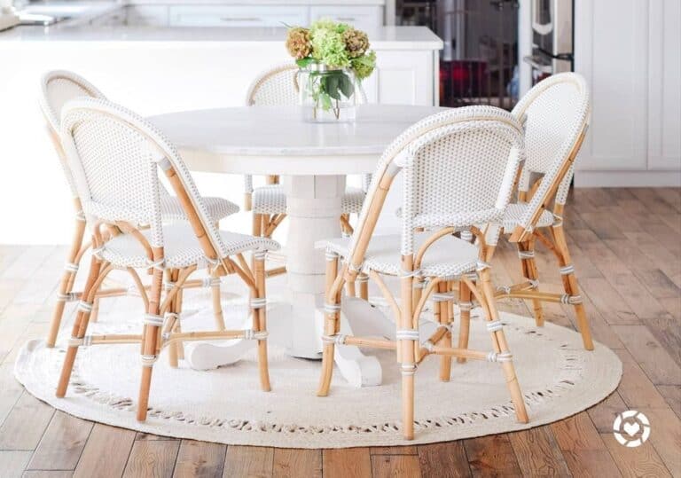 White and Wood Dining Chairs on a Circular White Rug