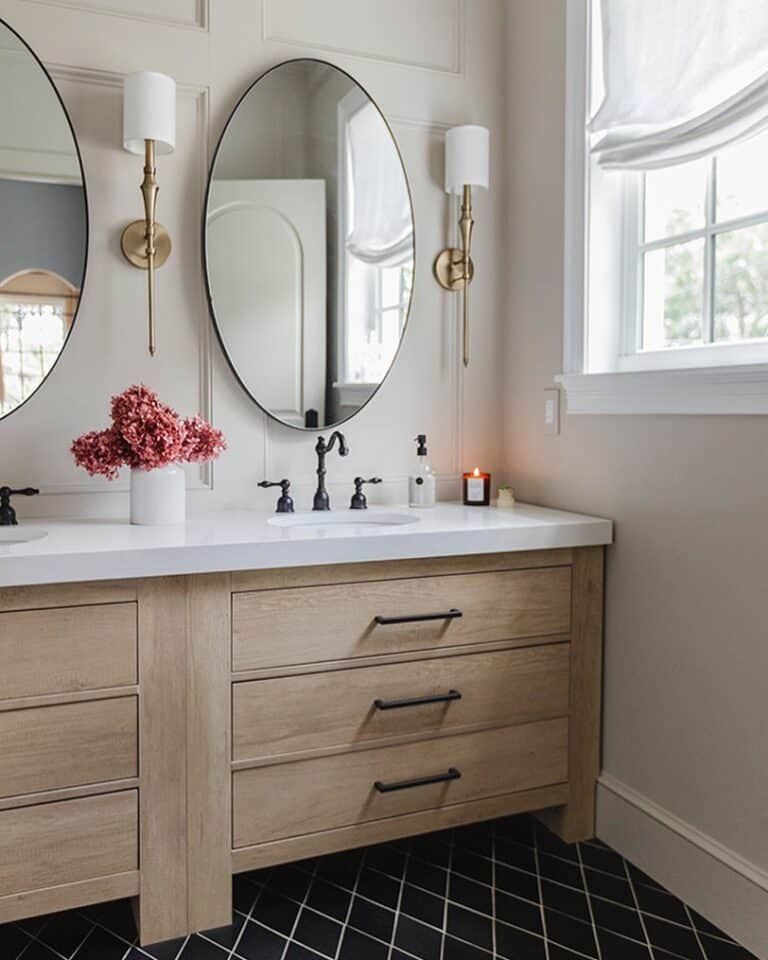 Wood Vanity with Oval Mirrors and Sconces