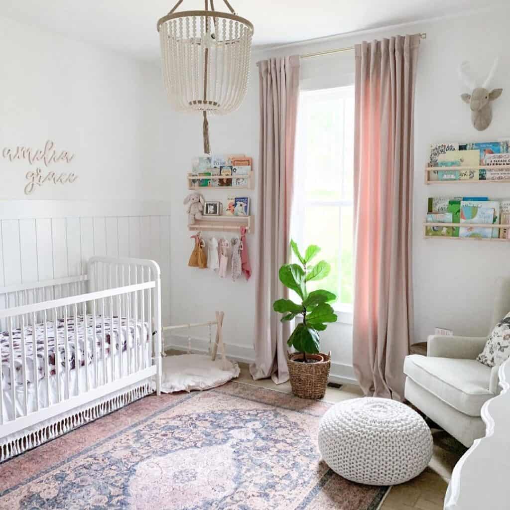 Baby Girl Nursery with White Pouf Ottoman