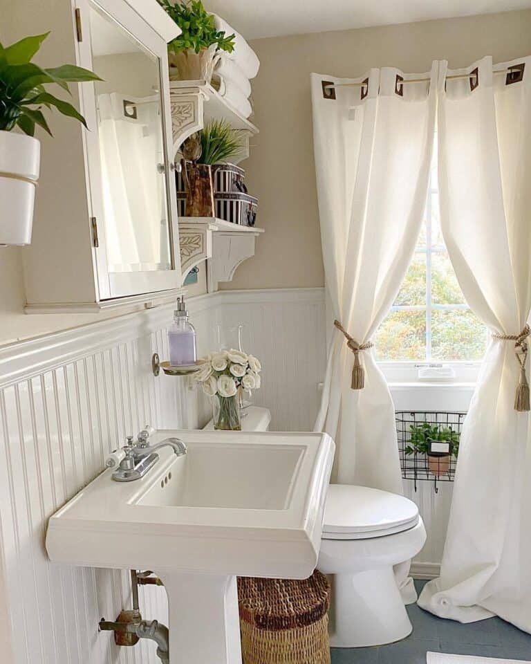 Beadboard Wainscoting and White Pedestal Sink
