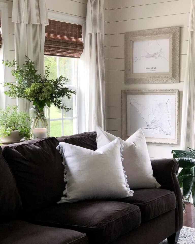 Black Couch Beside Shiplap Walls