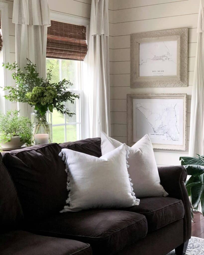 Black Couch Beside Shiplap Walls