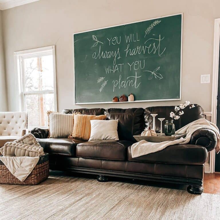 Black Couch with Autumnal Décor