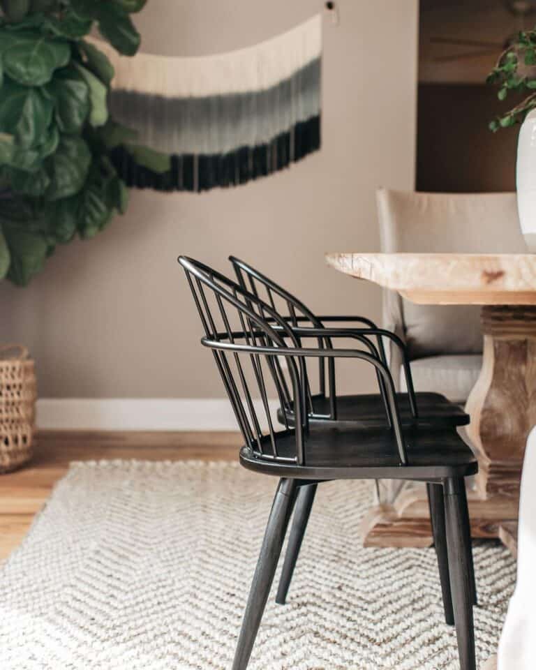 Black Dining Chairs With Arms on a White Rug