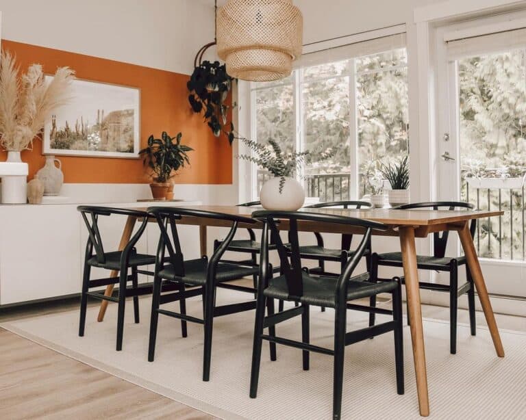 Black Dining Chairs and an Orange Nook