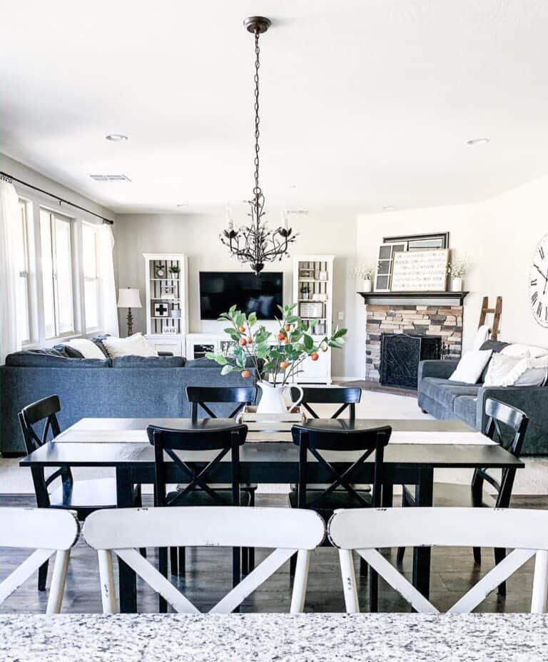 Black Dining Table Beside Farmhouse Living Space
