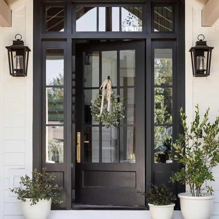 Black Farmhouse Front Door With Glass Between Black Sconces
