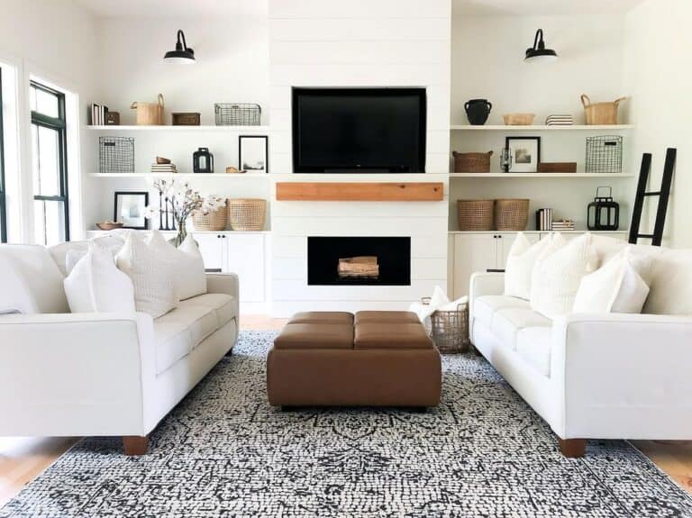 Black Living Room Sconces Illuminate Shelf Décor
