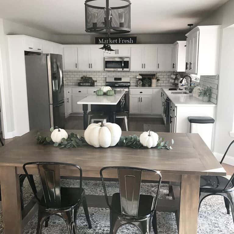 Black Metal Dining Chairs and White Pumpkins