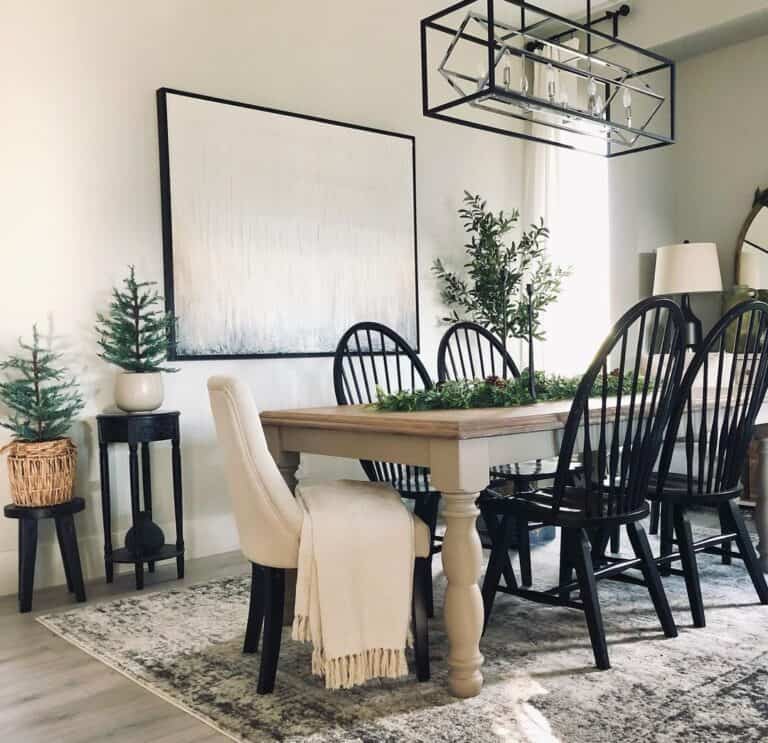 Black Spindle Back Chairs Around Greenery Centerpiece