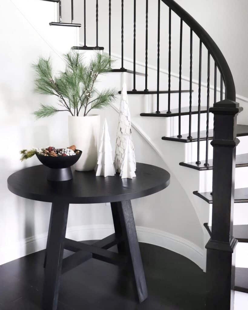 Black Table with Winter Décor in Stairway Alcove