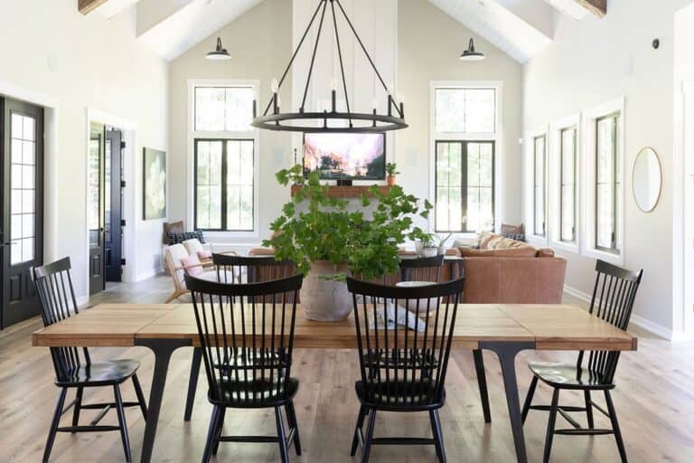 Black Windsor Chairs Around Dining Table with Botanical Centerpiece