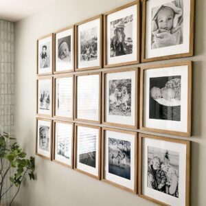Black and White Photo Gallery Wall in Light Wood Frames