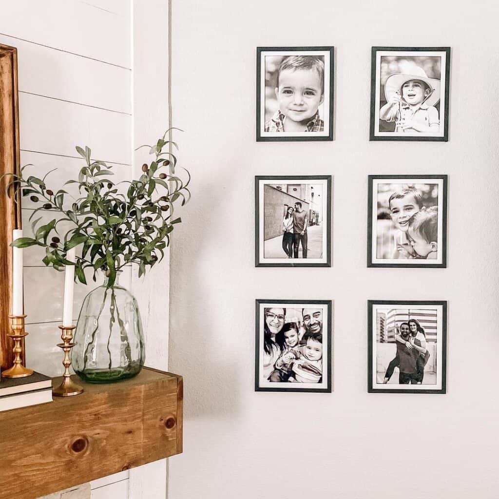Black and White Photos Beside Accessorized Wood Mantel