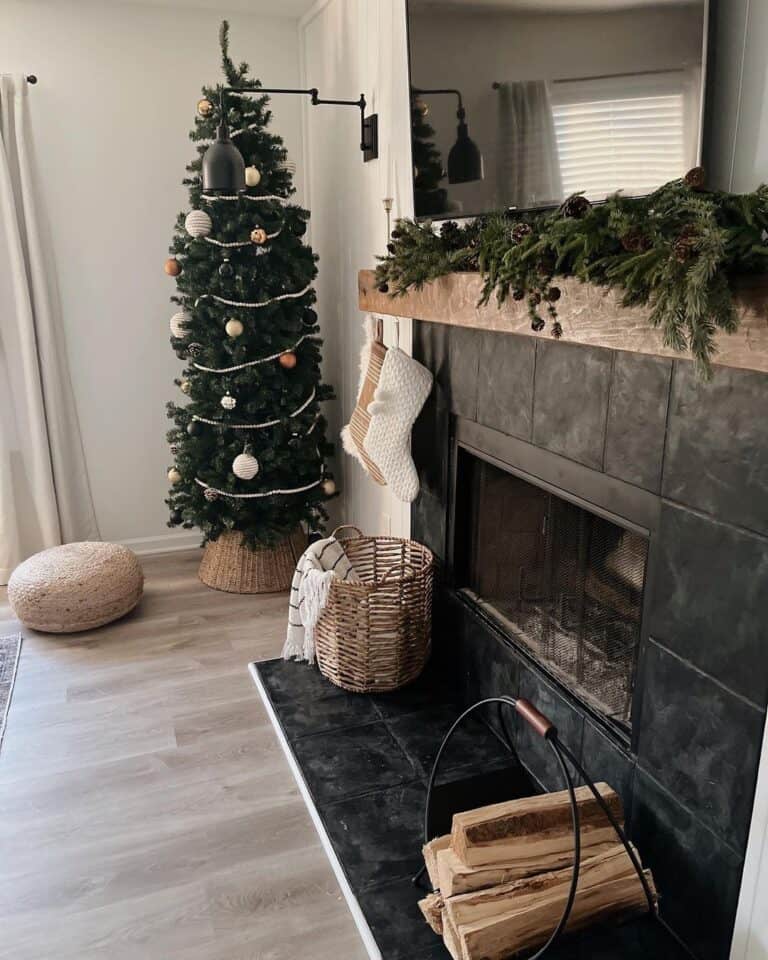 Brown and White Stockings Hanging on a Black Tile Fireplace