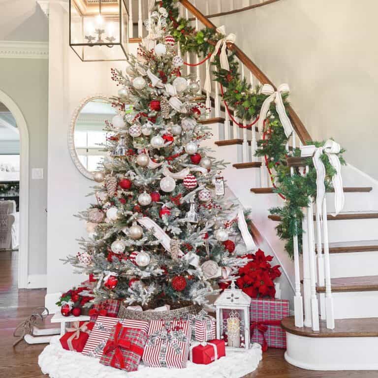 Christmas Tree Beside White and Wood Staircase
