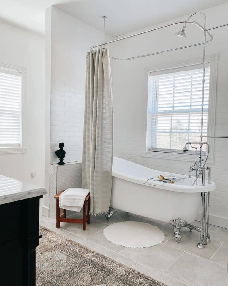 Chrome Clawfoot Bathtub Beneath Shower Window