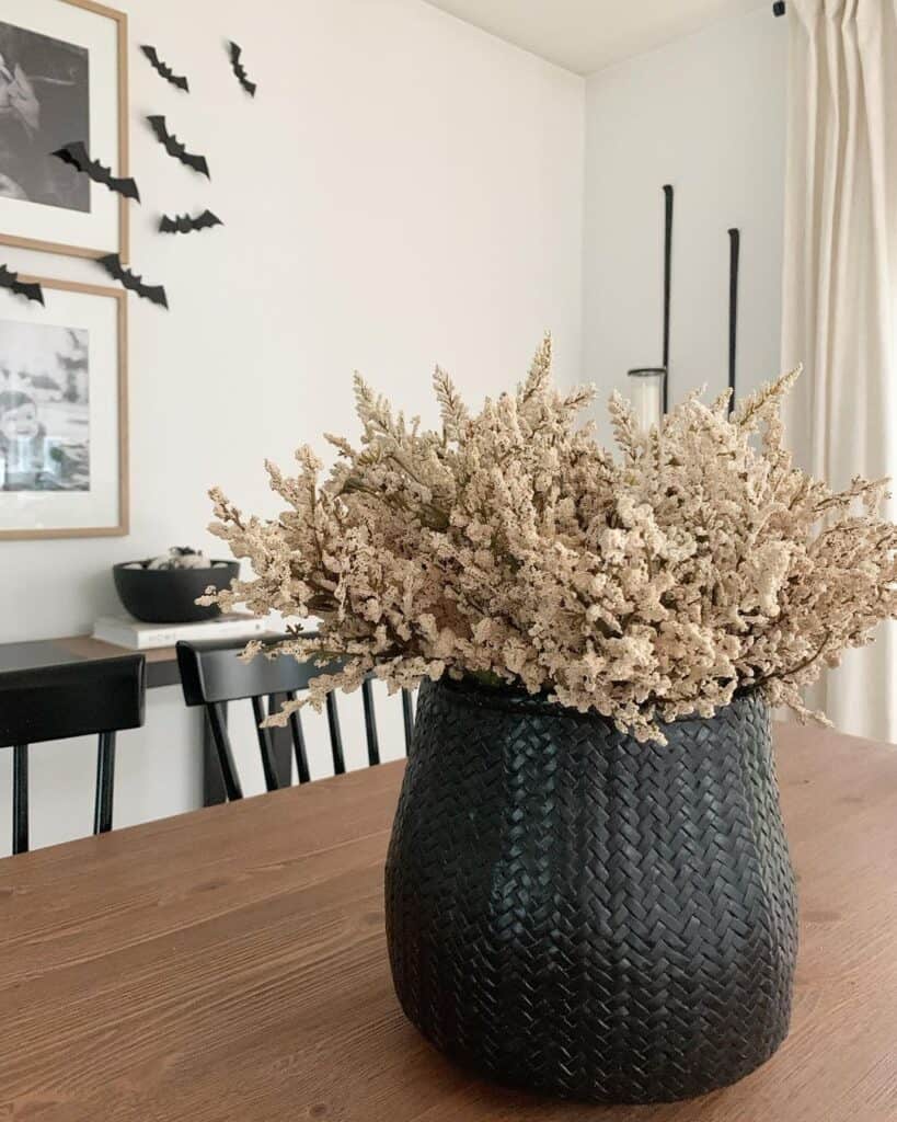 Dried White Flowers in a Black Vase