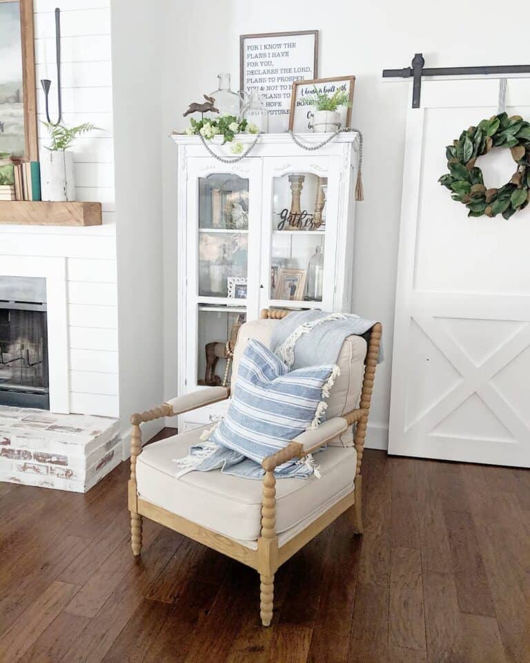 Dusty Blue Throw Pillow and a White Barn Door