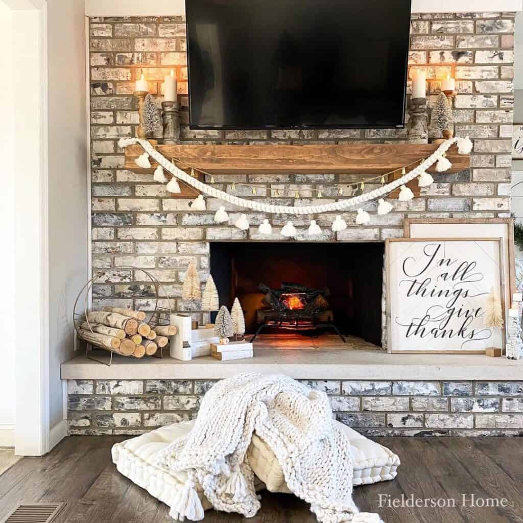 Exposed-Brick Fireplace with Tassel Garland