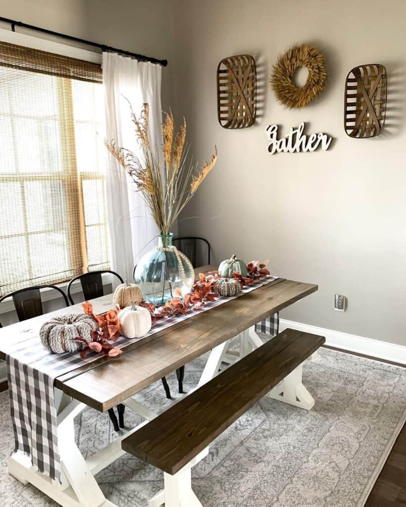 Farmhouse Table with Bench Seating and Red Decorations