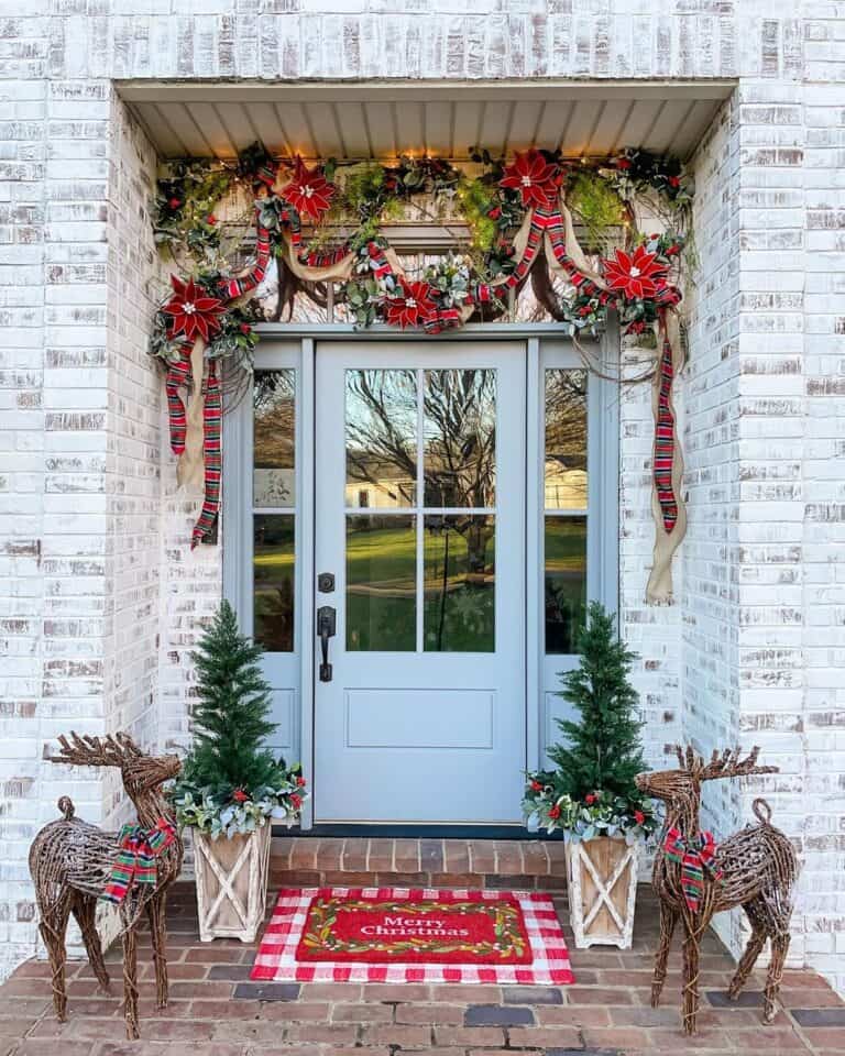 Festive Grapevine Garland Over a Farmhouse Front Door With Glass