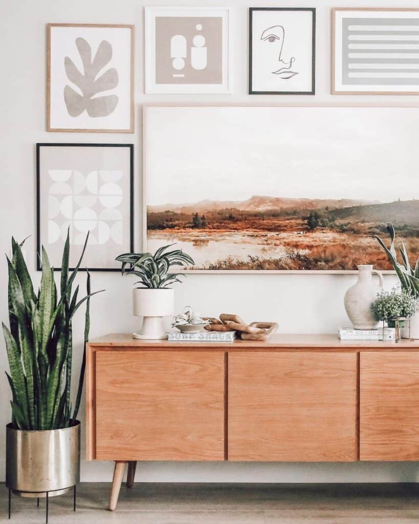 Gallery of Artwork Over a Console Table