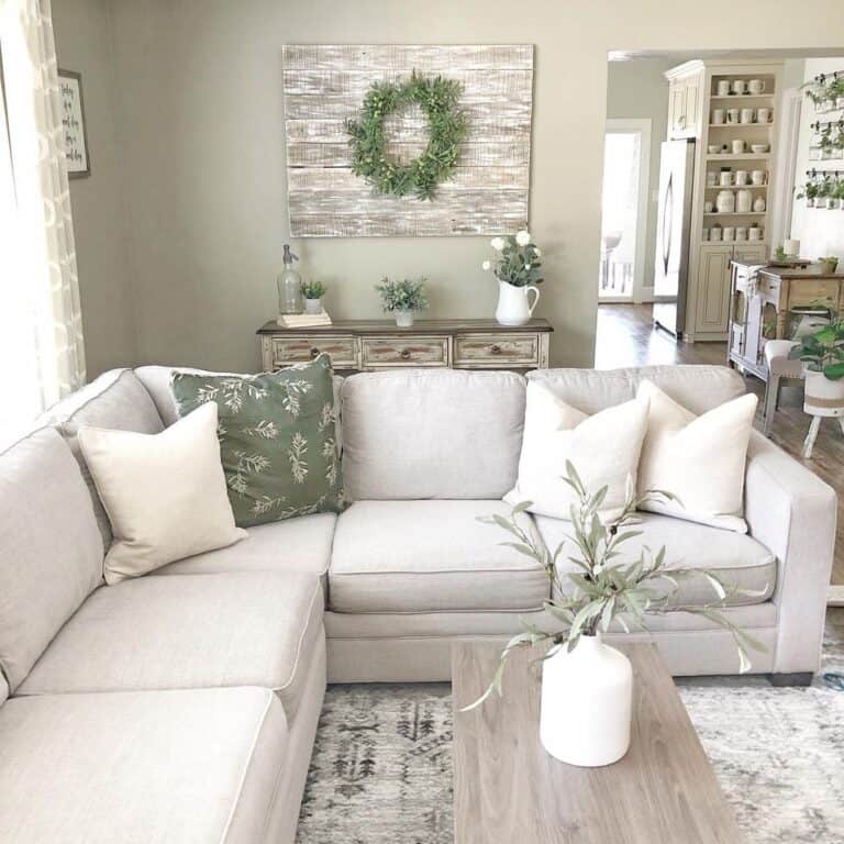 Green Accent Pillow on Off-White Sectional