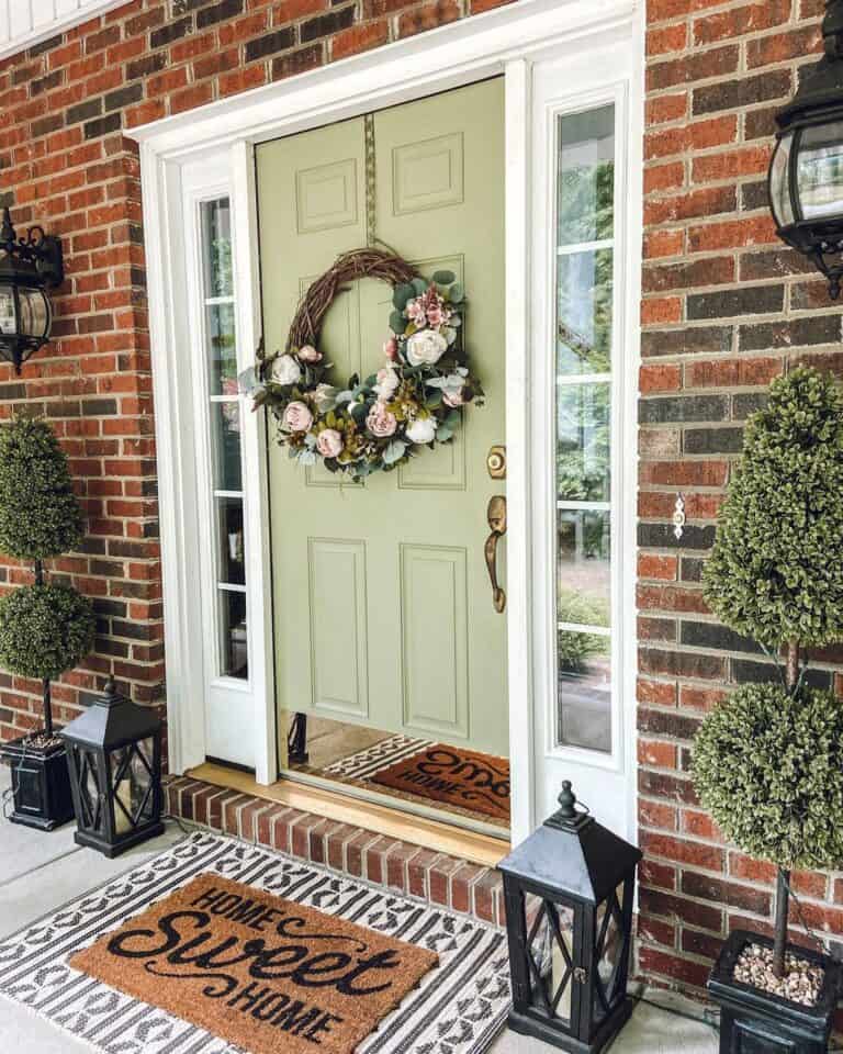 Green Front Door With Sidelights on a Brick House