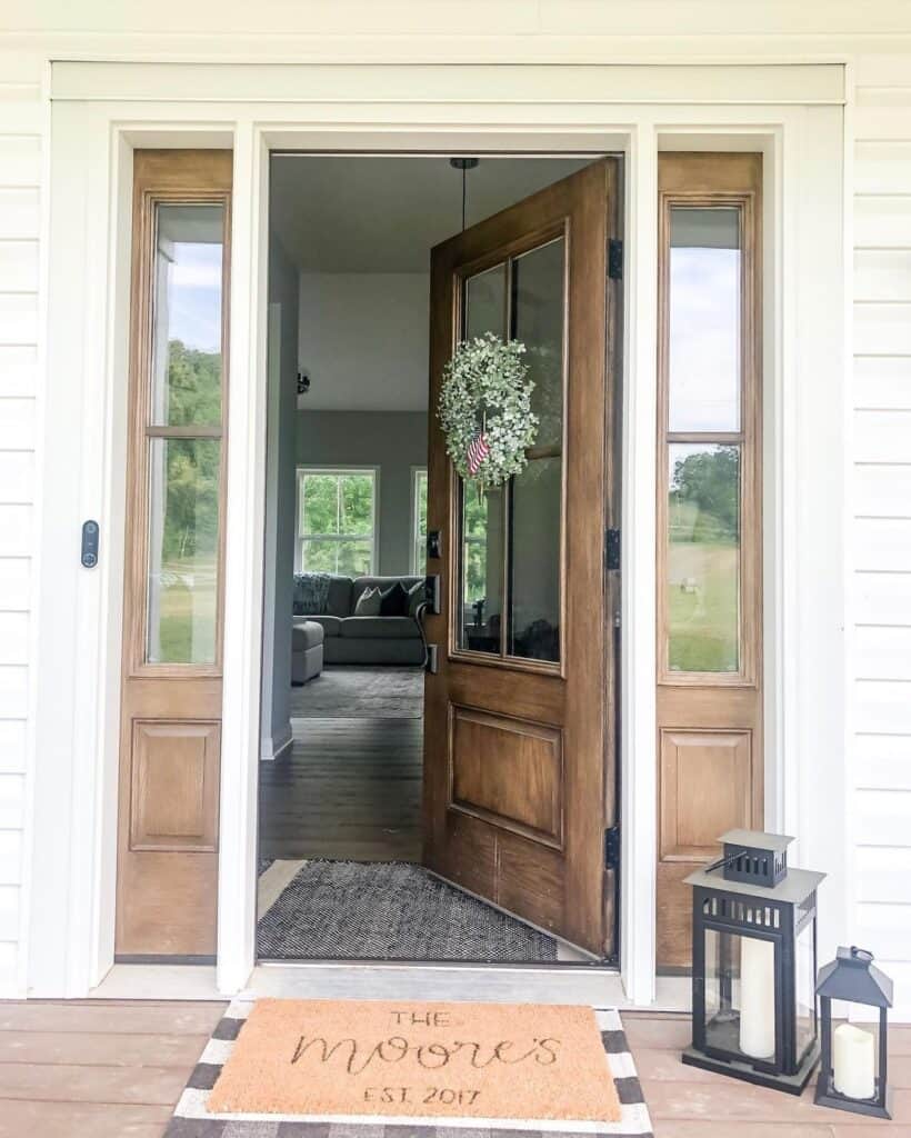 Green Wreath on a Wooden Farmhouse Front Door With Glass