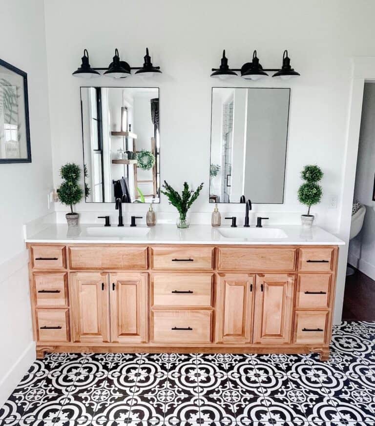Intricate Black and White Floor Tiles and Black Sconces