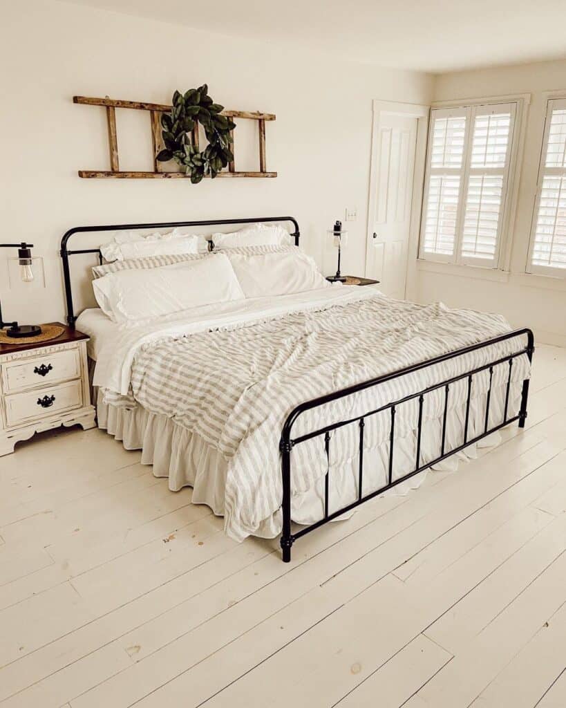 King Black Bed Frame With Striped Bedding Soul Lane king-black-bed-frame-with-striped-bedding-soul-lane