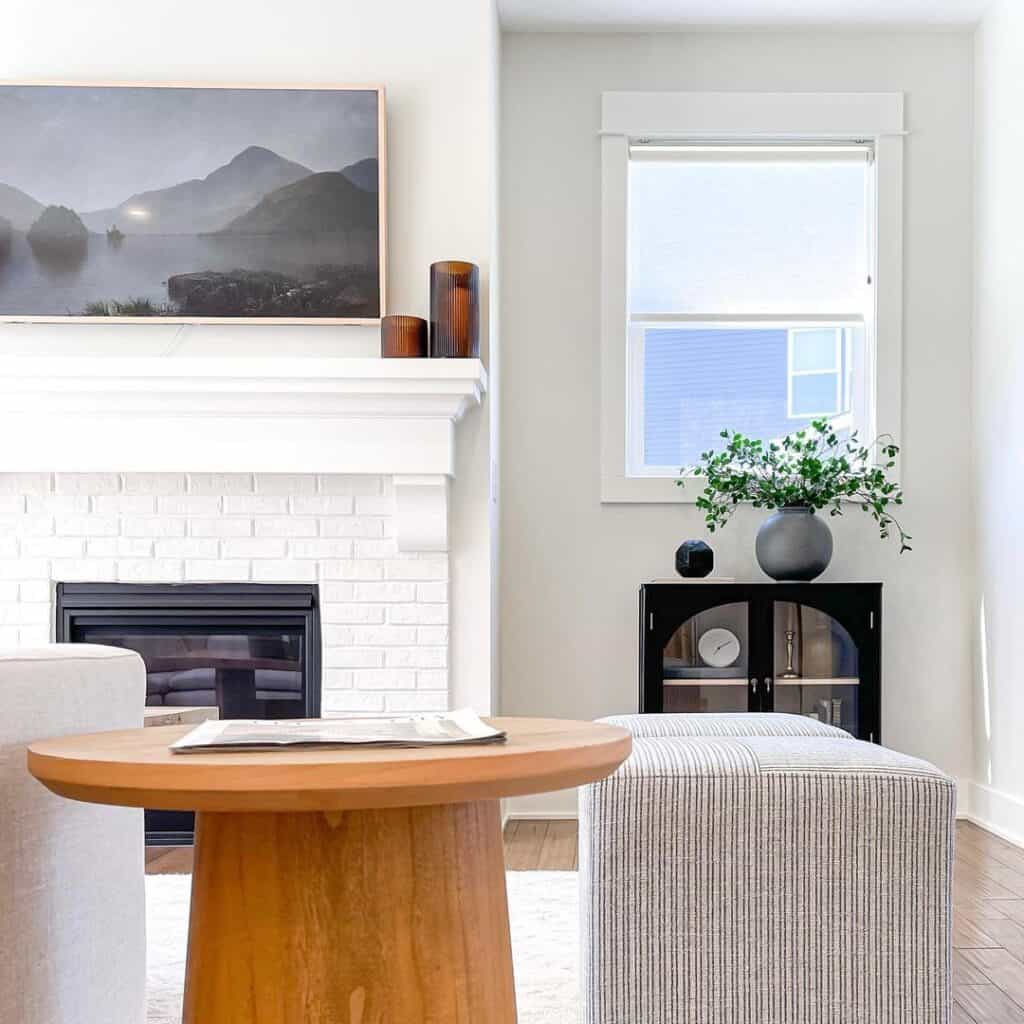 Landscape Above a White Brick Fireplace