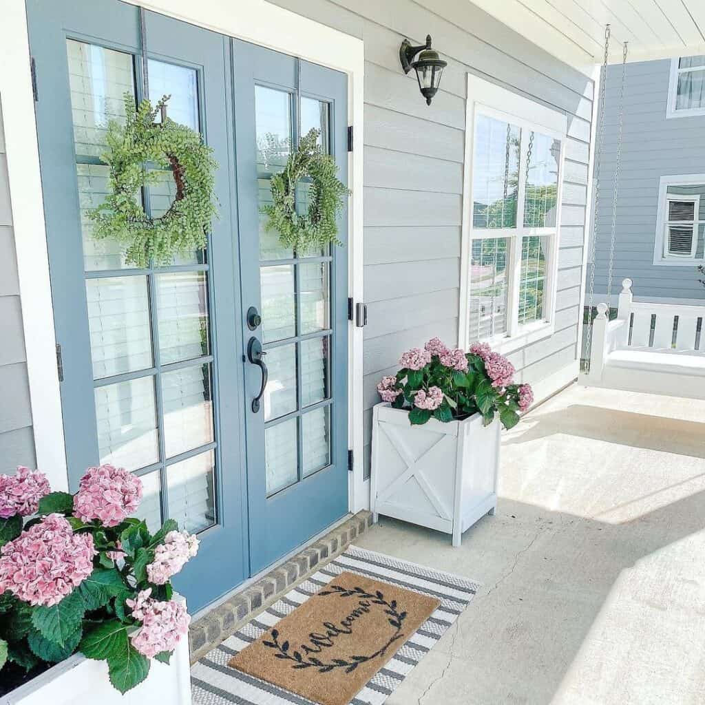 Light Blue Double Doors with Concrete Porch